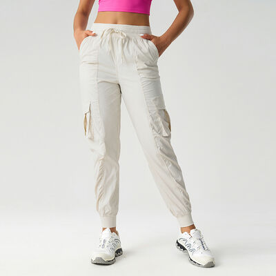 comprar Pantalones cargo de nailon beige para mujer con cordón, múltiples bolsillos, ligeros y con puños elásticos online manufacture